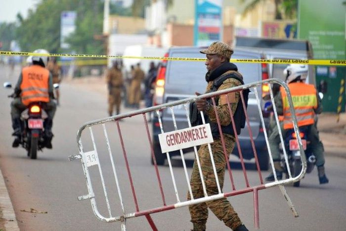 Burkina Faso police tighten security after gunmen attack a restaurant in the capital Ouagadougou, leaving 18 people dead