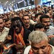 French forward Bafetimbi Gomis (C) is greeted by fans as he arrives at the Ataturk International airport on June 28, 2017 in Istanbul