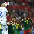 Chile's midfielder Arturo Vidal (C) scores a header against Cameroon on June 18, 2017