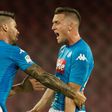 Napoli's midfielder Piotr Zielinski (R) celebrates after scoring with teammate during the Italian Serie A football match against Atalanta August 27, 2017