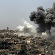 A picture taken on July 9, 2017, shows smoke billowing following an airstrike by US-led international coalition forces targeting Islamic State group in Mosul