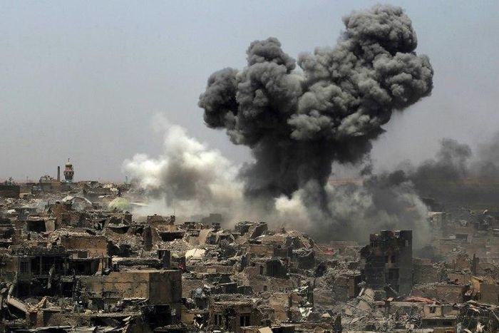 A picture taken on July 9, 2017, shows smoke billowing following an airstrike by US-led international coalition forces targeting Islamic State group in Mosul