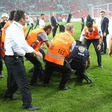 Turkish police detain a supporter after football fans invaded the pitch during the Super Cup match between Besiktas and Konyaspor on August 6, 2017