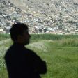 A birdwatcher looks on at the Kol-e Hashmat Khan wetland in the outskirts of Kabul