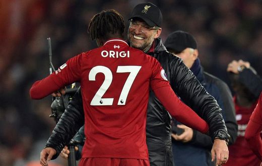 Liverpool manager Jurgen Klopp embraces foward Divock Origi after his late winner against Everton