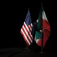 Iranian and US flags fly side by side at nuclear talks in Vienna on July 14, 2015 at which a historic deal was clinched