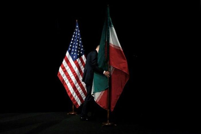 Iranian and US flags fly side by side at nuclear talks in Vienna on July 14, 2015 at which a historic deal was clinched
