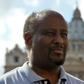 Eritrean priest Mussie Zerai poses in front of Saint Peter's basilica on October 4, 2015 in Vatican