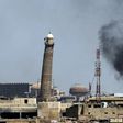 Smoke billows behind the emblemati Al-Nuri mosque in Mosul's Old City, where Iraqi forces have launched an assault on the Islamic State group