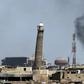 Smoke billows behind the emblemati Al-Nuri mosque in Mosul's Old City, where Iraqi forces have launched an assault on the Islamic State group