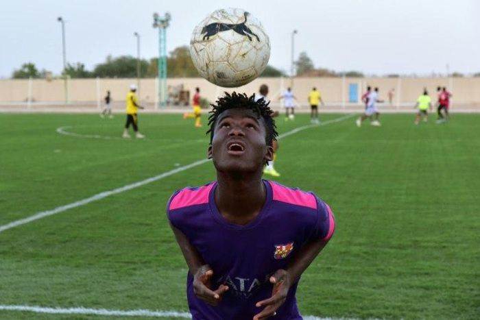 Mohamed Diaby, a 16-year-old from Ivory Coast who hopes to migrate to Europe, training with Nassara Agadez, a team in Niger's second division