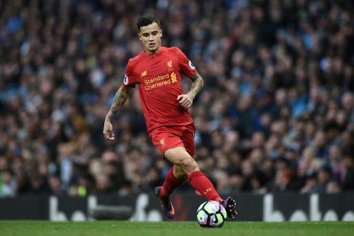 Liverpool's midfielder Philippe Coutinho runs with the ball during the English Premier League football match against Manchester City March 19, 2017