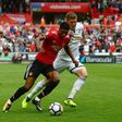 Manchester United's Marcus Rashford (L) vies with Swansea City's Alfie Mawson during their match in Swansea, south Wales on August 19