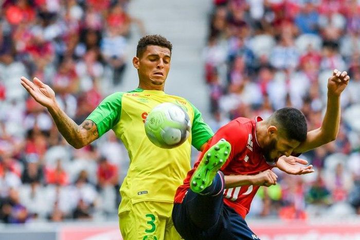 Lille's Anwar El Ghazi (R) clashes with Nantes' Diego Carlos during their French Ligue 1 match, at Pierre Mauroy Stadium in Villeneuve d'Ascq, on August 6, 2017