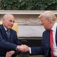 US President Donald Trump (R) shakes hands with newly sworn-in White House Chief of Staff John Kelly