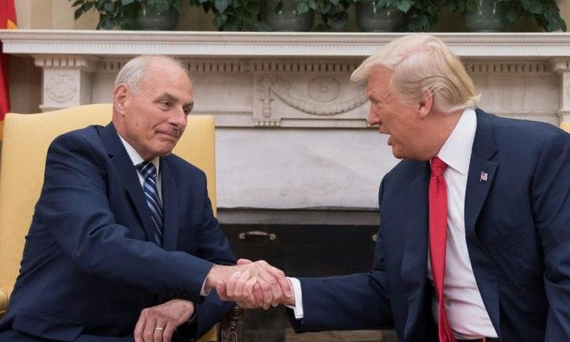 US President Donald Trump (R) shakes hands with newly sworn-in White House Chief of Staff John Kelly