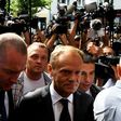 Donald Tusk (c), EU president and former Polish prime minister, arrives at the prosecutor's office to testify as a witness in the investigation of the 2010 plane crash that killed President Lech Kaczynski.