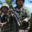 Philippine troops ride on their truck on their way to the frontline in the outskirts of Marawi on the southern island of Mindanao