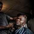 Time for a trim: Ibrahim goes to a barber's shop, one of numerous businesses that have sprung up on the reserve