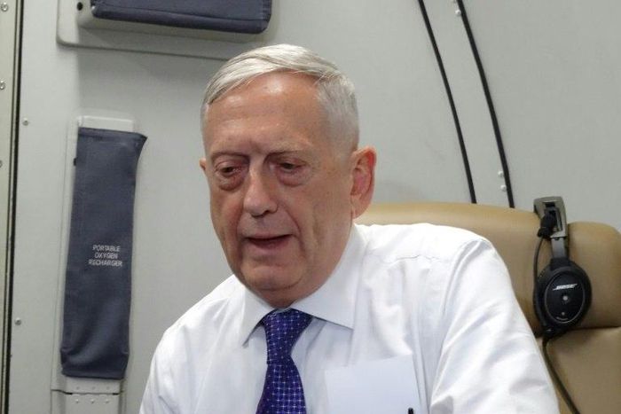 US Defense Secretary James Mattis speaks to reporters on board a flight to Jordan for the start of a regional tour on August 20, 2017