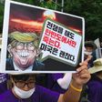 South Korean protesters hold placards at an anti-Trump rally