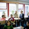 Dutch Queen Maxima and Dutch state secretary of education Sander Dekker sit in on a lesson at an elementary school--Dekker refused to grant an Islamic school funding after a member of the board voiced support for the Islamic State