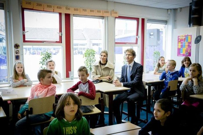 Dutch Queen Maxima and Dutch state secretary of education Sander Dekker sit in on a lesson at an elementary school--Dekker refused to grant an Islamic school funding after a member of the board voiced support for the Islamic State