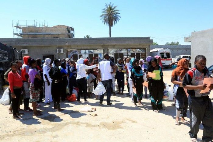 African migrants gather at a centre in the Libyan capital on August 17, 2017 ahead of being repatriated to their country of origin under a voluntary programme coordinated by the International Organization for Migration (IOM)