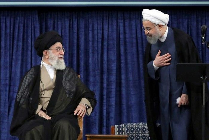 Iranian President Hasan Rouhani (R) speaks with supreme leader Ayatollah Ali Khamenei during his swearing-in on August 3, 2017