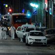 Forensic policemen arrive in the cordoned off area on Las Ramblas in Barcelona on August 17, 2017 after a van ploughed into the crowd, killing 13 people and injuring over 80