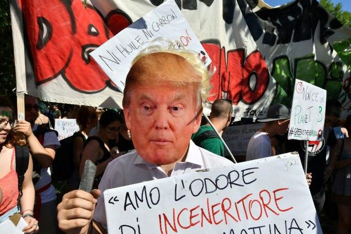 A demonstration against US President Donald Trump's decision to quit the Paris climate accord, at the meeting of G7 environment ministers in Bologna, Italy