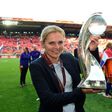 Netherlands' head coach Sarina Wiegman celebrates with the trophy after winning with her team the UEFA Women's Euro 2017 tournament final match against Denmark, at FC Twente Stadium in Enschede, on August 6, 2017