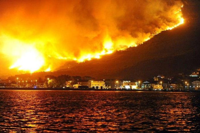 Smoke and flames rise from a blaze above Podstrana, near the Croatian Adriatic coastal town of Split, on July 18, 2017
