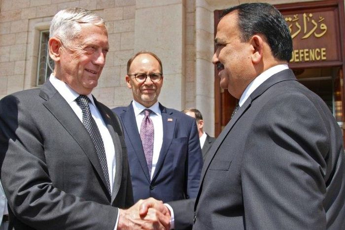 A handout picture from the Iraqi Ministry of Defence shows Iraq's Defence Minister Irfan al-Hayali (R) welcoming US Defence Secretary Jim Mattis in Baghdad on August 22, 2017