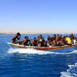 Libyan coastguards help rescue illegal immigrants attempting to reach Europe off the coastal town of Guarabouli, 60 kilometres east of the capital, on July 8, 2017
