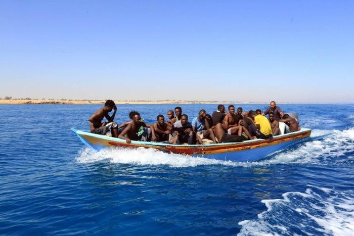 Libyan coastguards help rescue illegal immigrants attempting to reach Europe off the coastal town of Guarabouli, 60 kilometres east of the capital, on July 8, 2017