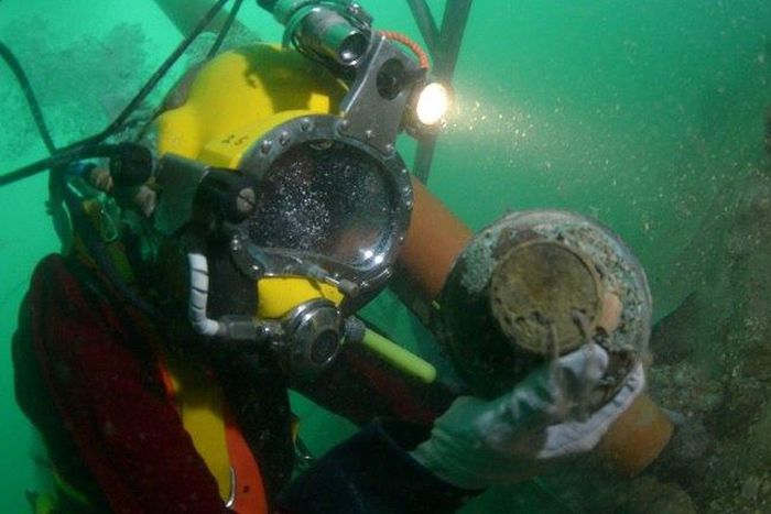 A diver works on the wreck of the Rooswijk, a Dutch East India Company ship which sank in 1740, on the sea bed off the coast of Ramsgate, southeast England, in a picture released by Historic England in London on August 18, 2017