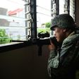 A Philippine Marine in July 2017 observed Islamic militant positions on the frontline in Marawi on the southern island of Mindanao. The US is weighing sending additional support to help the fight against IS