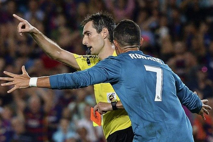 Real Madrid forward Cristiano Ronaldo gestures after receiving a red card during the first leg of the Spanish Super Cup against Barcelona on August 13, 2017