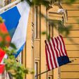 A Russian flag flies next to the US embassy building in Moscow on July 31, 2017