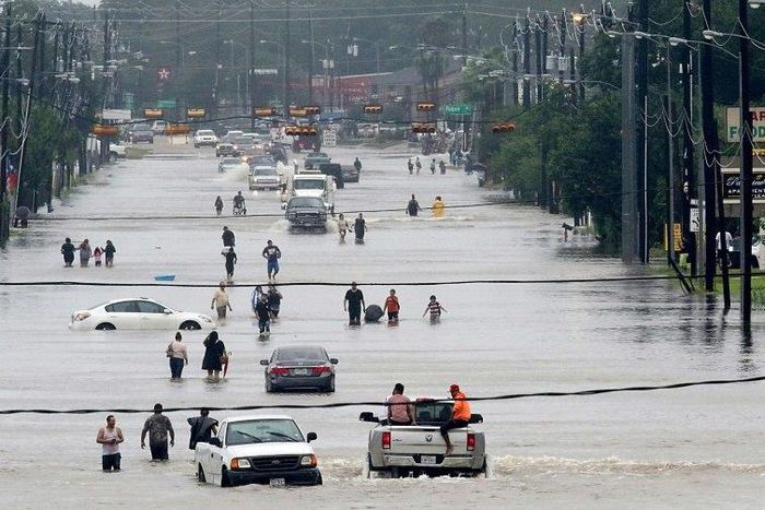 At least three people have been killed in the widespread flooding caused by tropical storm Harvey in Houston