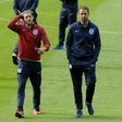 England's midfielder Adam Lallana (L) and team manager Gareth Southgate arrive at the Hampden Park stadium in Glasgow for a squad walkaround session on June 9, 2017, on the eve of their World Cup Group F qualifying match against Scotland