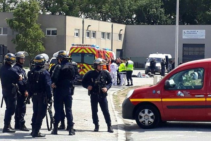 Police officers and emergency workers intervene after clashes between African migrants in what officials say is escalating violence in the northern French port of Calais