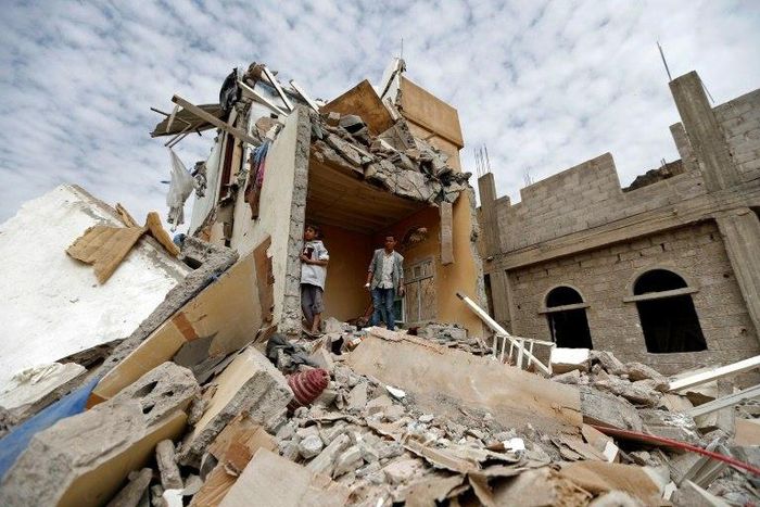 Yemenis stand in the rubble of a residential building destroyed in an air strike in the southern Faj Attan district of the capital, Sanaa, on August 25, 2017