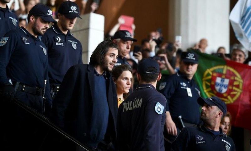 Eurovision contest winner Salvador Sobral is greeted by hundreds of cheering fans as he returns to Portugal from Kiev