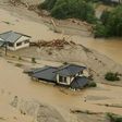 This aerial view shows homes flooded and buried in dirt in the city of Asakura, Fukuoka prefecture, on July 6, 2017