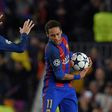 Barcelona's forward Neymar (R) and defender Gerard Pique celebrate Paris Saint-Germain's own goal during the UEFA Champions League round of 16 second leg football match March 8, 2017