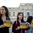 Activists hold signs reading "Stop criminalizing women, Free and safe abortion" and "Verbal, sexual or institutional, it is violence anyway" during a pro-abortion demo on November 11, 2014