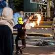 Opposition activists clash with the police in Caracas during a protest against Venezuelan President Nicolas Maduro
