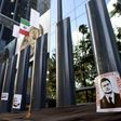 Stickers with the image of Mexican President Enrique Pena Nieto are stuck on columns outside the building of the attorney general's office during a protest against alleged government spying on journalists and human rights defenders in Mexico City last ...
